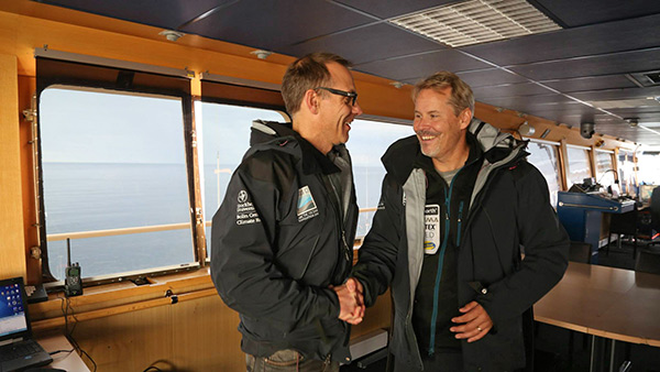 Örjan Gustafsson (left, Chief scientist Leg 1) and I shake hands at the bridge. Photographer: Stella Papadopoulou